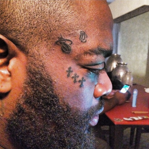 rick ross face tattoo
