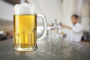 Mug of light beer in pub