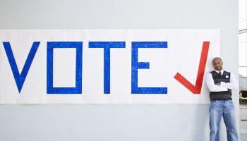 Man standing with vote sign