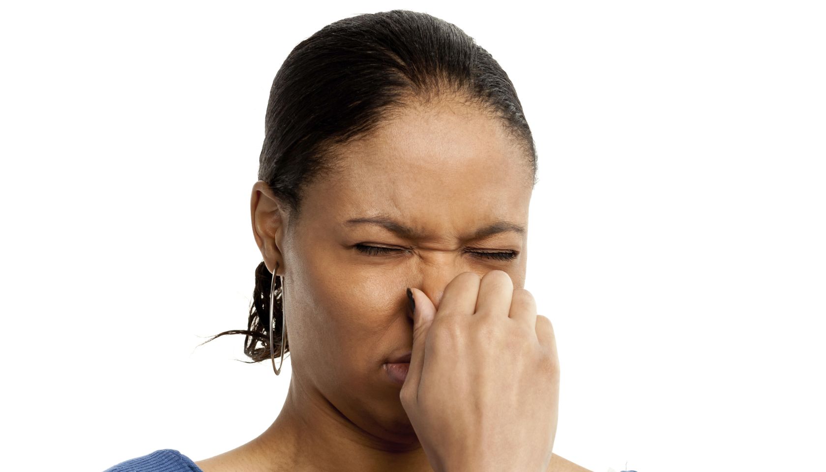 Frowning Young Woman Pinching Nose