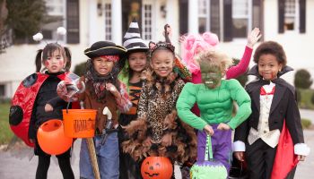 Children (4-7) dressed up for Halloween, group portrait