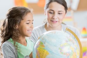 Curious elementary student learns geography