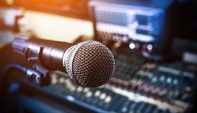 Microphone over the Abstract blurred on sound mixer out of focus background
