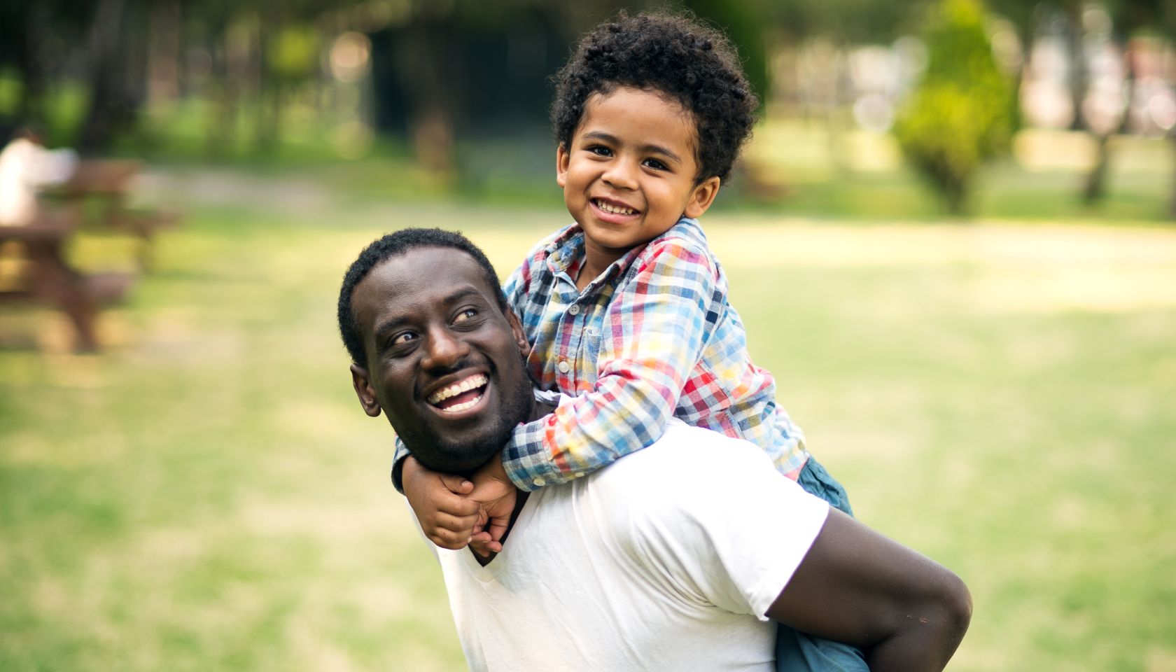 Father and son at the park having fun.