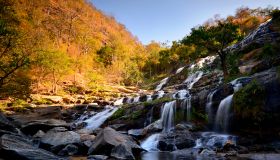 Autumn landscape , Waterfall in deep forest chiang mai Thailand .