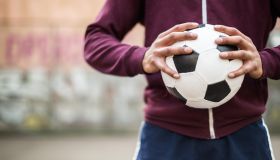 Soccer Player Holding Vintage Soccer Ball