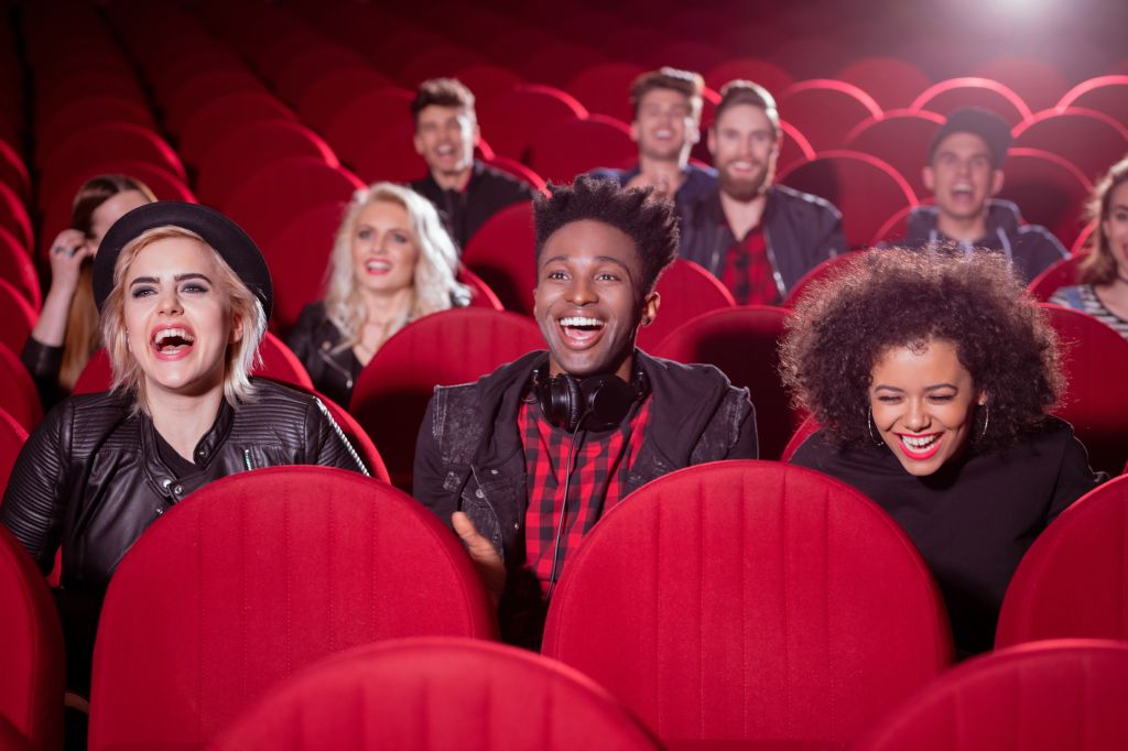 Multi ethnic group of people in the cinema