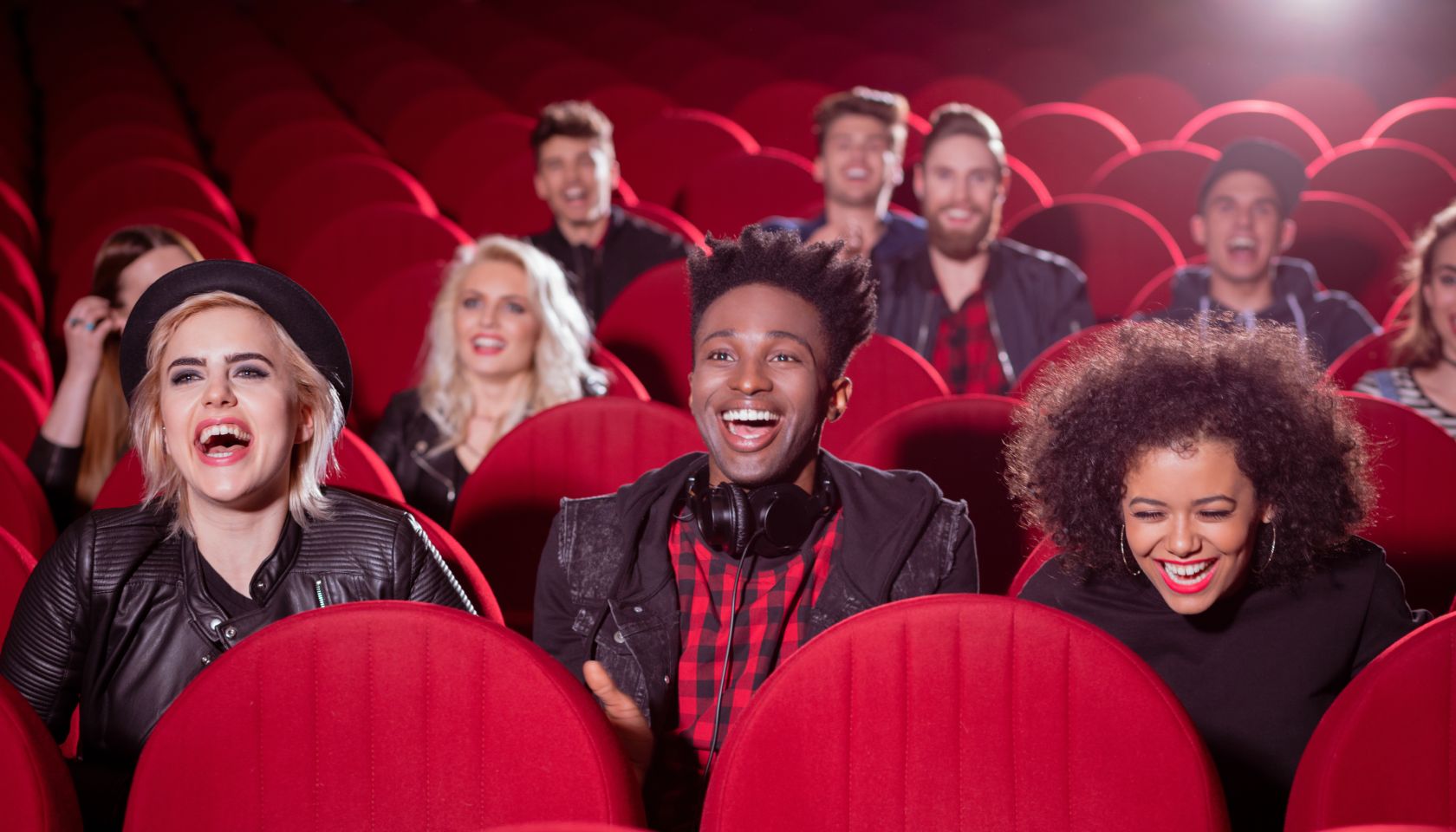 Multi ethnic group of people in the cinema