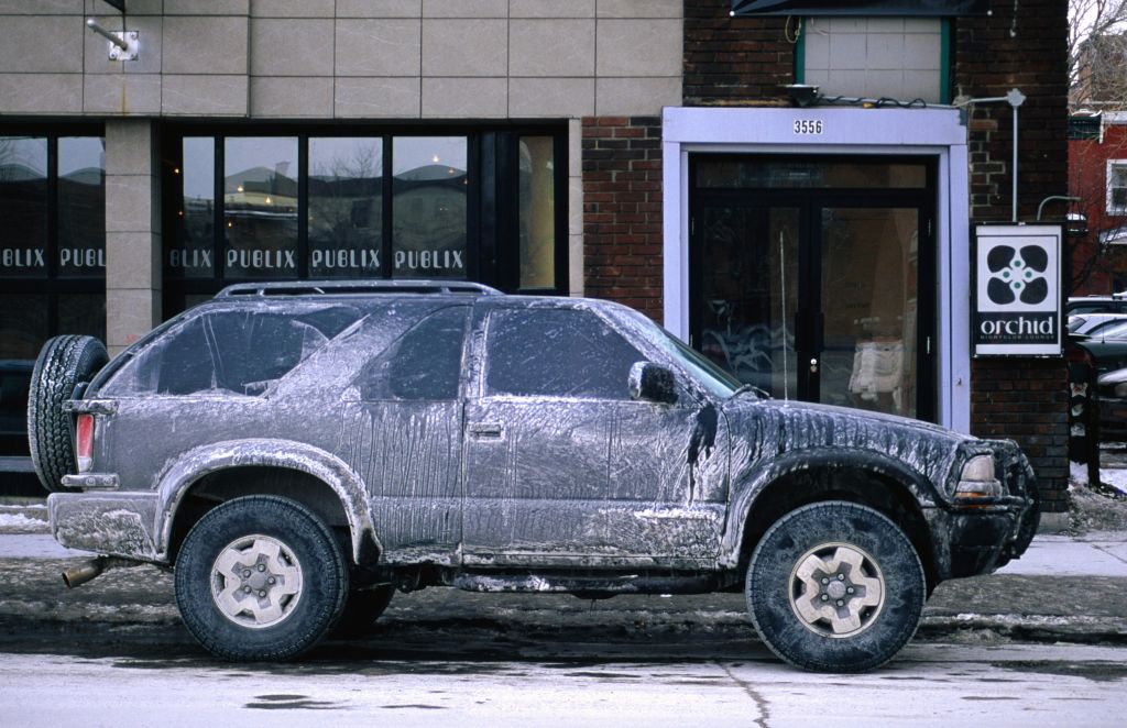 Dirty car in winter. Roads are salted to keep snow and ice at bay, but inevitably cars get rusty.