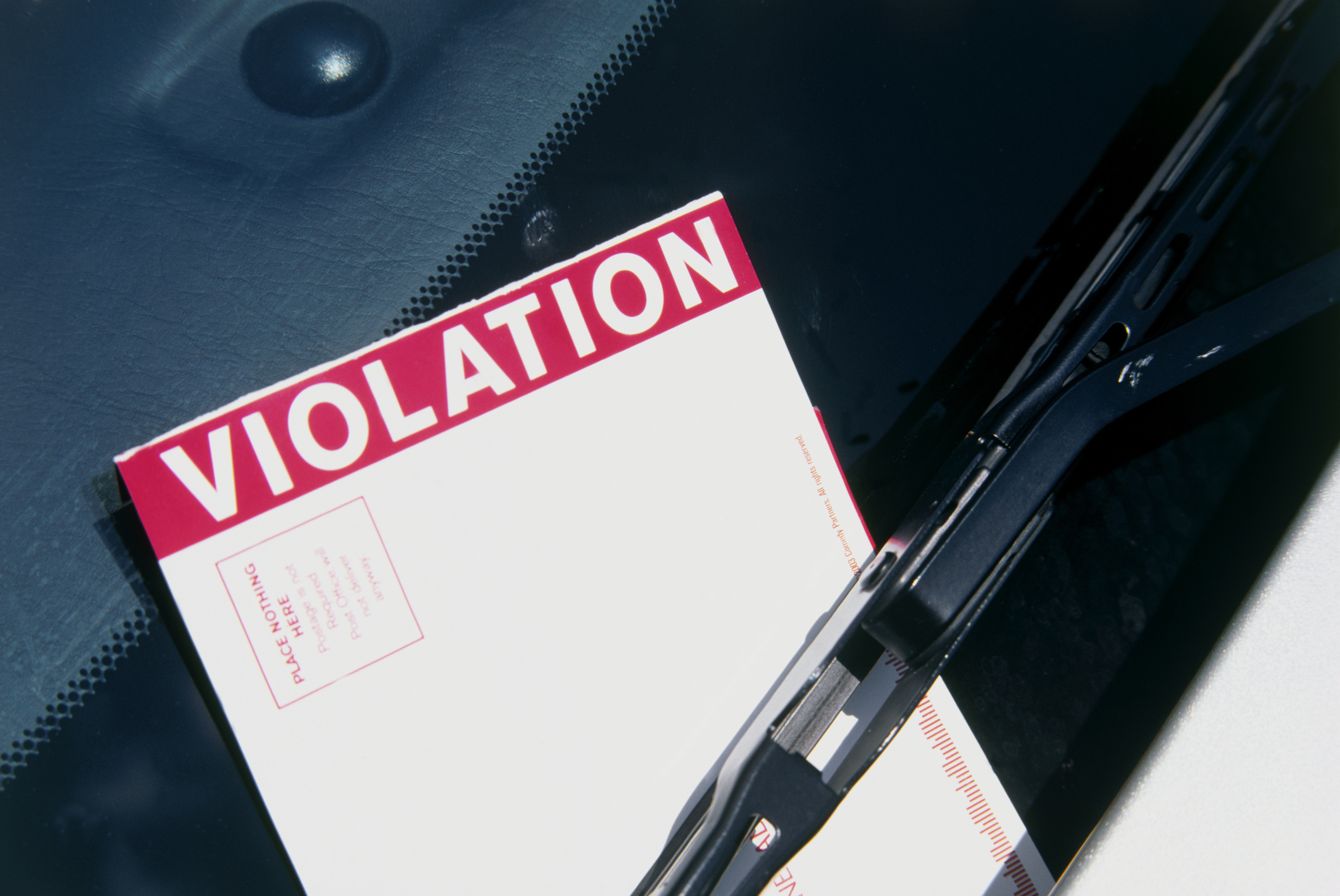 Parking ticket on a windscreen wiper