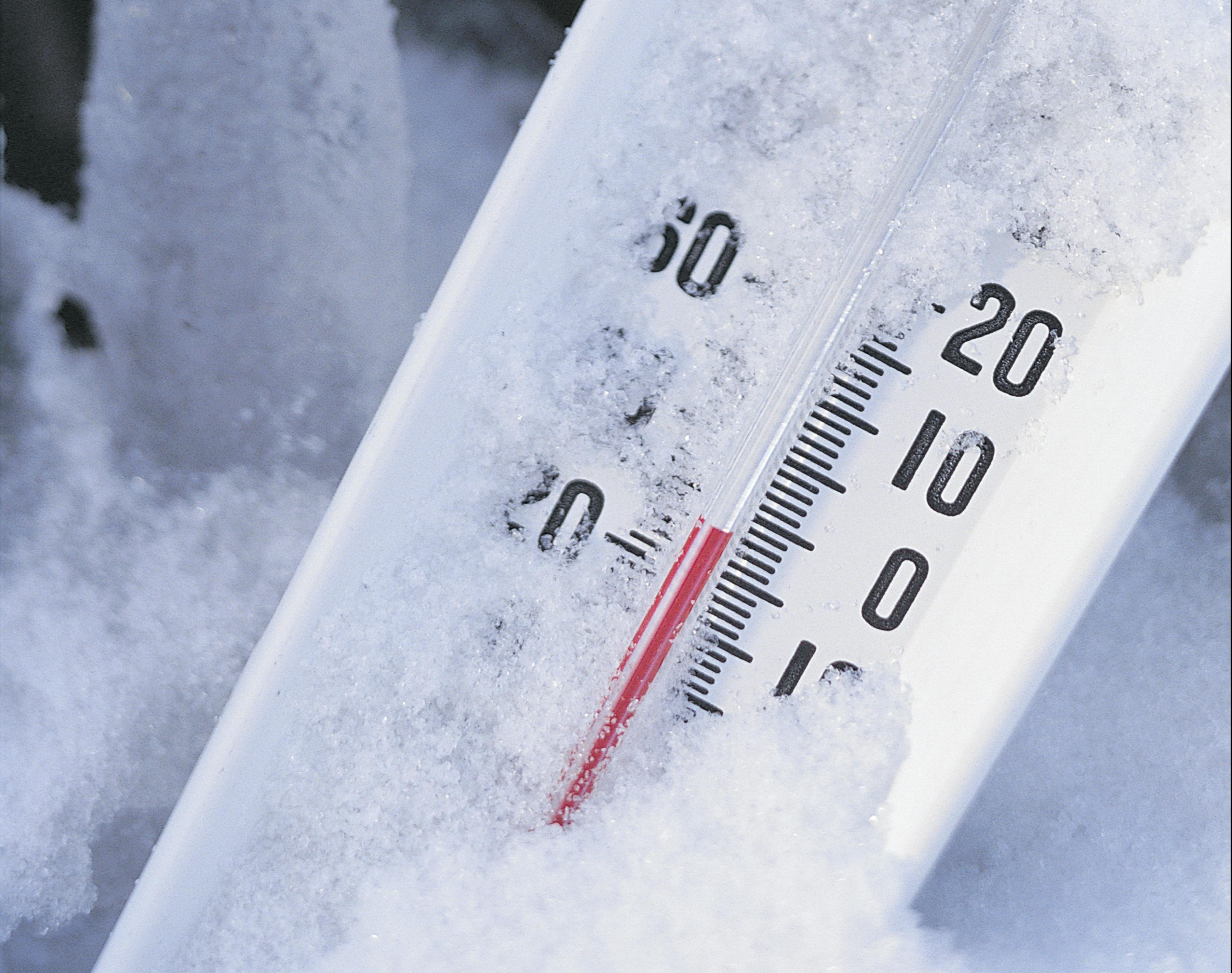 Thermometer registers below zero in snow