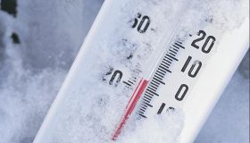 Thermometer registers below zero in snow
