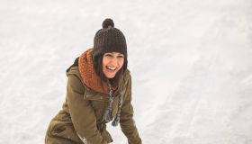 Young woman laughing on snow