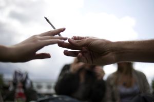 People smoke a joint during a demonstrat