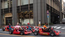 People driving karting cars dressed in super Mario, Kanto region, Tokyo, Japan...