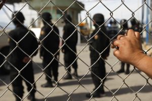 A relative of an inmate observes policem