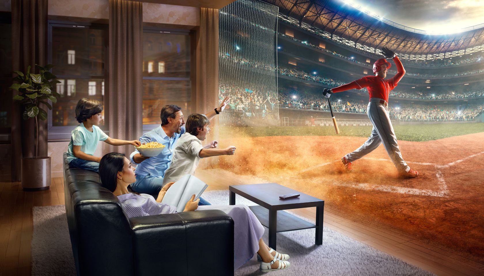 Family with children cheering and watching Baseball game on TV