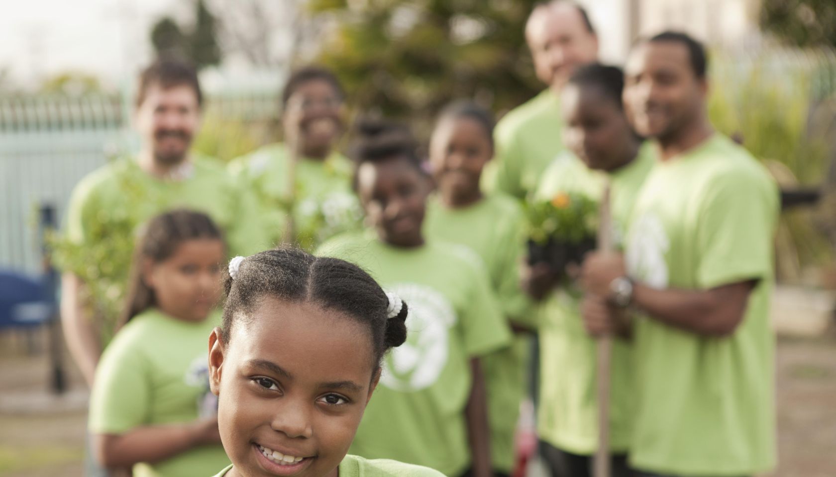 Volunteers planting flowers in playground