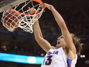 Florida's Joakim Noah puts away a slam dunk during the secon