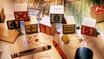 Child's drawings, crayons and blocks, elevated view