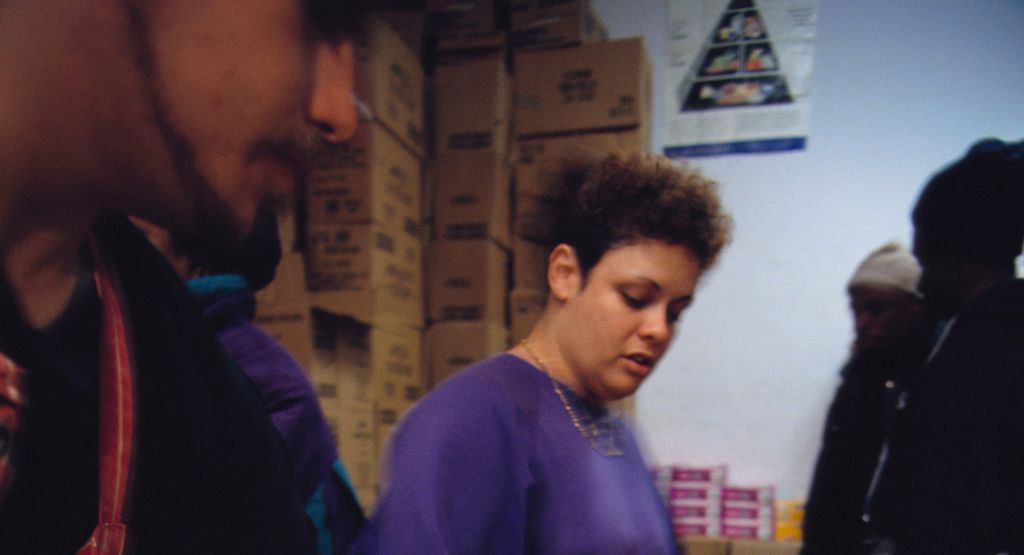 Volunteers Distribute Baskets of Food at a Food Pantry
