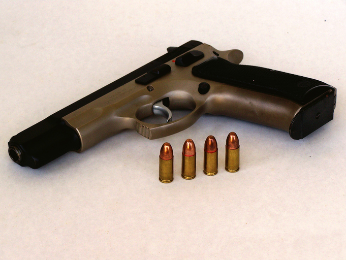 Close-Up Of Gun Over White Background