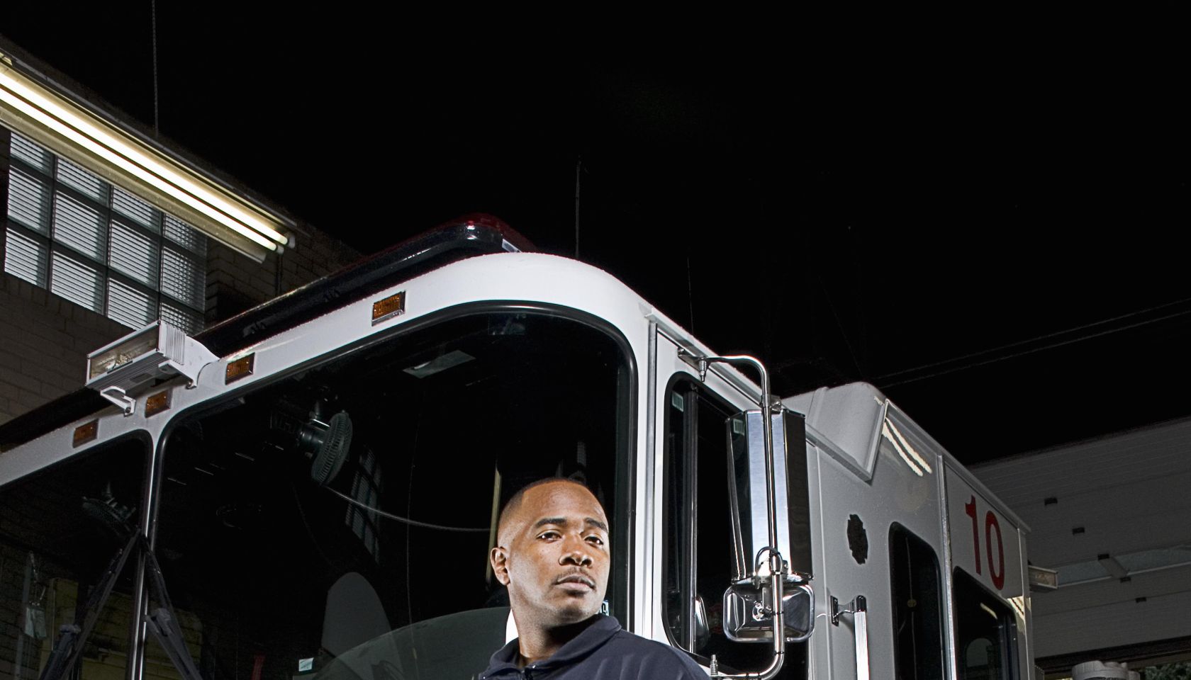 Firefighter in front of fire truck