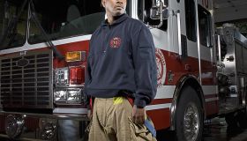 Firefighter in front of fire truck