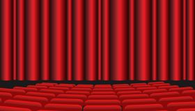 Movie theater with red seats and red curtain