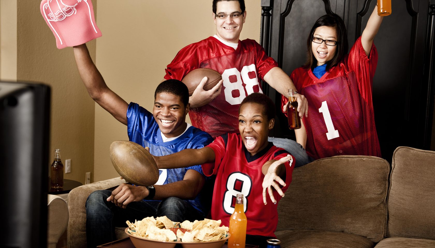 Football fans at home watching the game