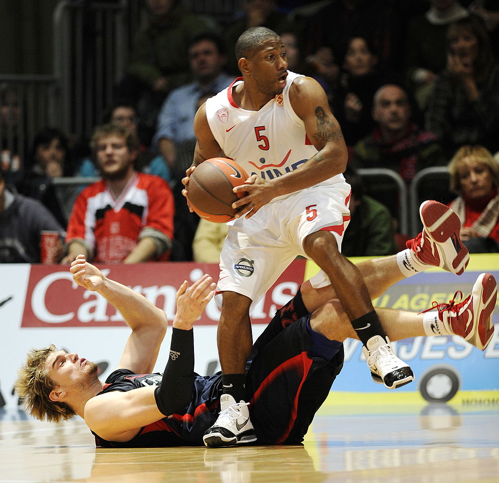 Caja Laboral's Tiago Splitter (L) falls