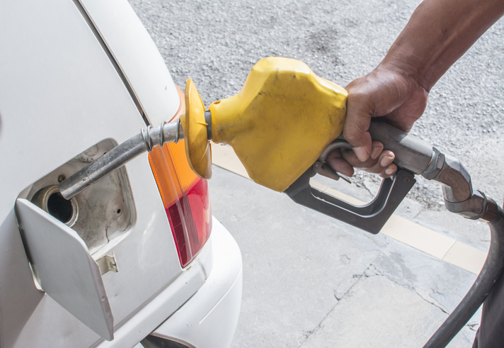 Cropped Hand Refueling Car At Gas Station