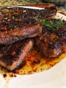 Herbed Strip Steak with Hennessy Garlic Butter