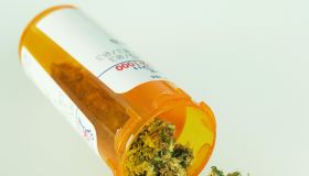 Marijuana spilling out of prescription bottle
