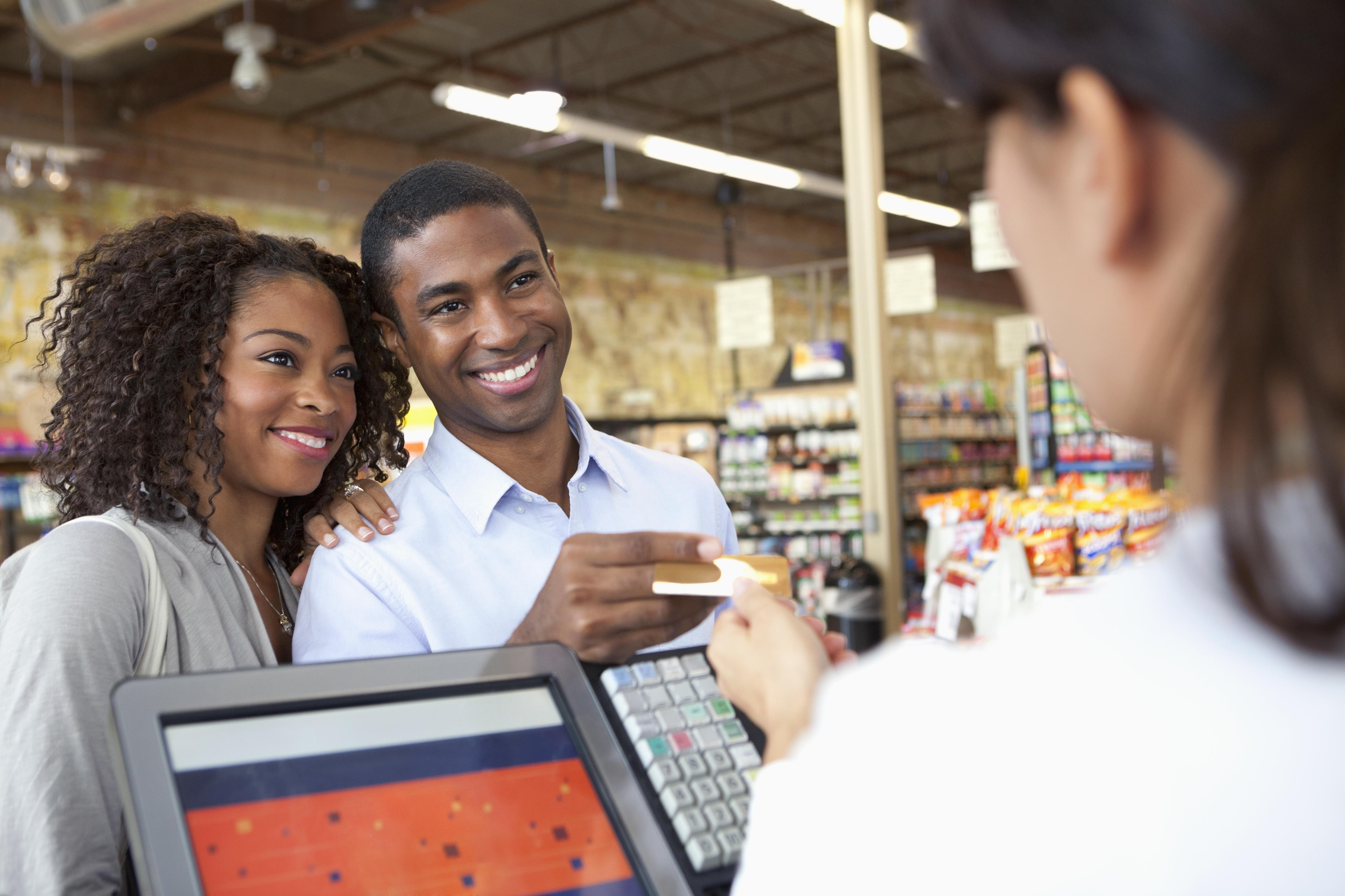 Couple buying groceries in supermarket