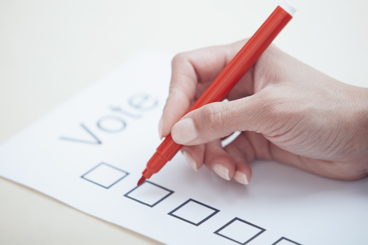 Woman filling out voting document