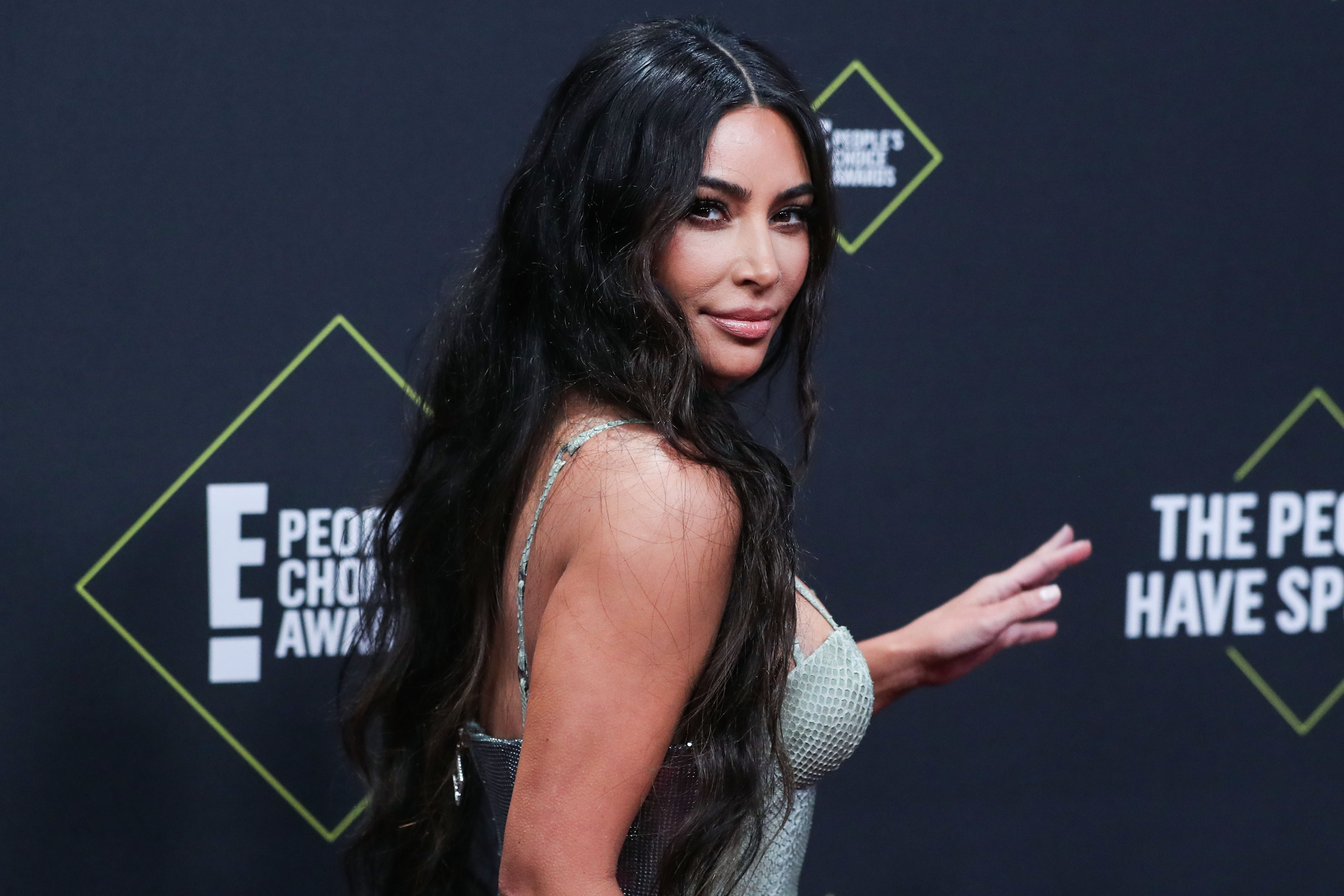 Kim Kardashian West wearing Versace arrives at the 2019 E! People's Choice Awards held at Barker Hangar on November 10, 2019 in Santa Monica, Los Angeles, California, United States.