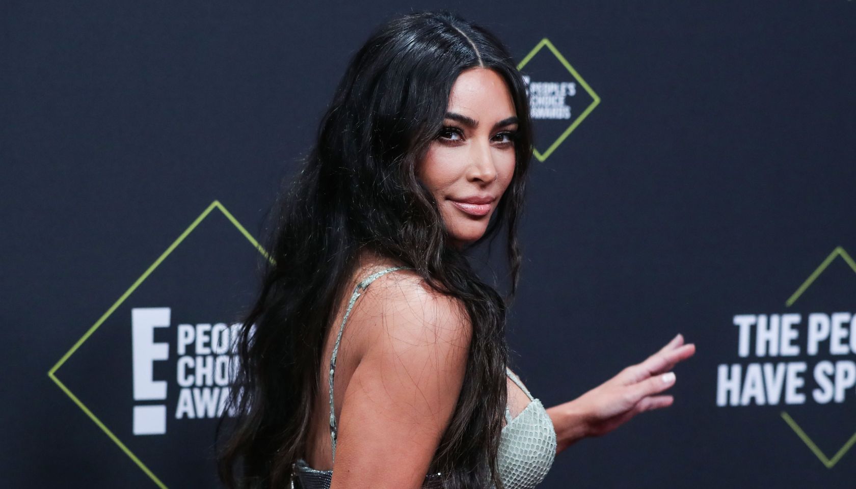 Kim Kardashian West wearing Versace arrives at the 2019 E! People's Choice Awards held at Barker Hangar on November 10, 2019 in Santa Monica, Los Angeles, California, United States.