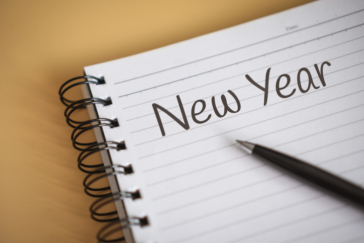 Close up of New Year Written on Notebook Corner