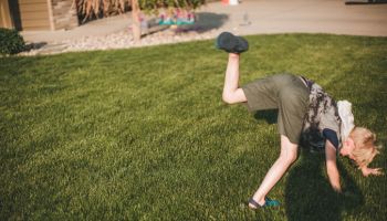 Boy attempting a cartwheel