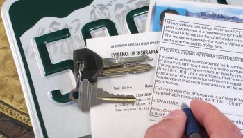 License Plate, Keys, and Papers Proving Evidence of Auto Insurance