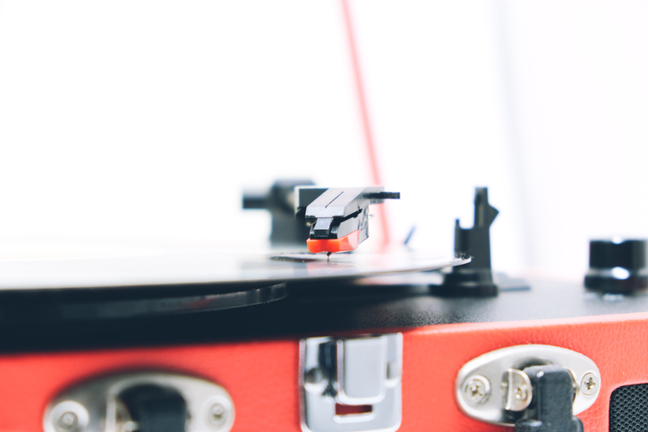 Portable record player against white background