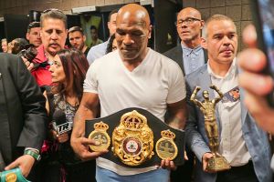 Mike Tyson shows off WBA belt during Mayweather/Pacquiao weigh-in