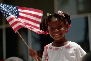 Girl Holds American Flag for Fourth of July