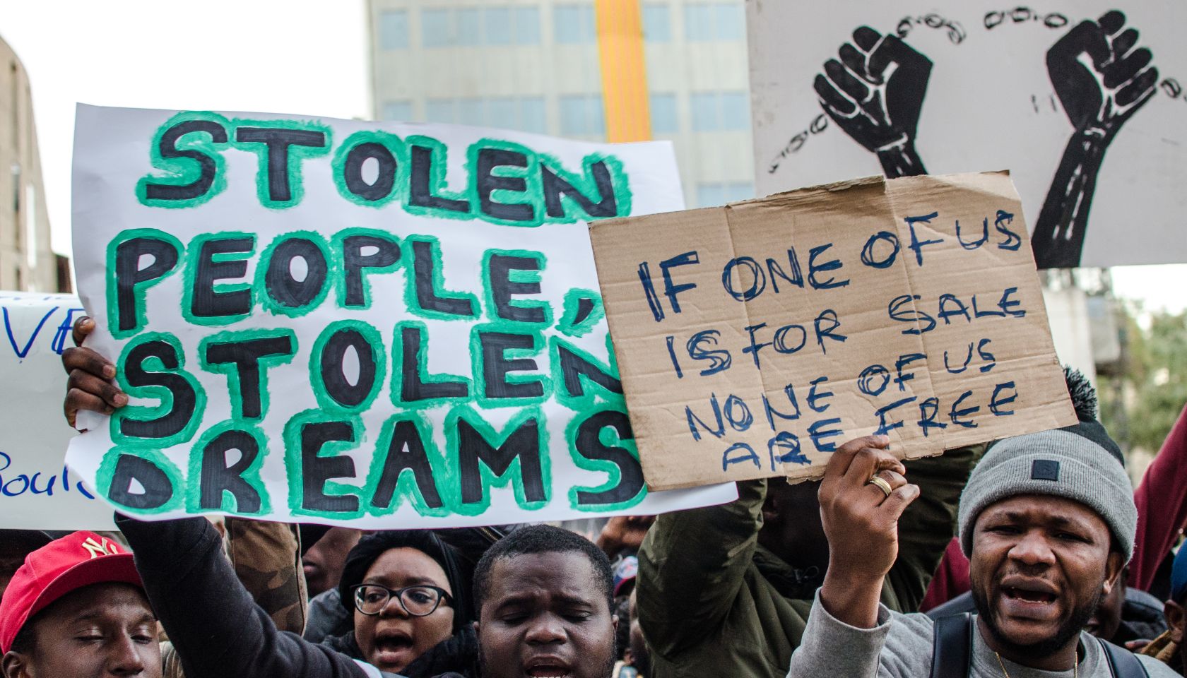 Several demonstrators seen displaying posters while shouting...