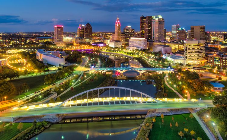 Columbus Downtown Skyline, River And Bridges Aerial At Dusk